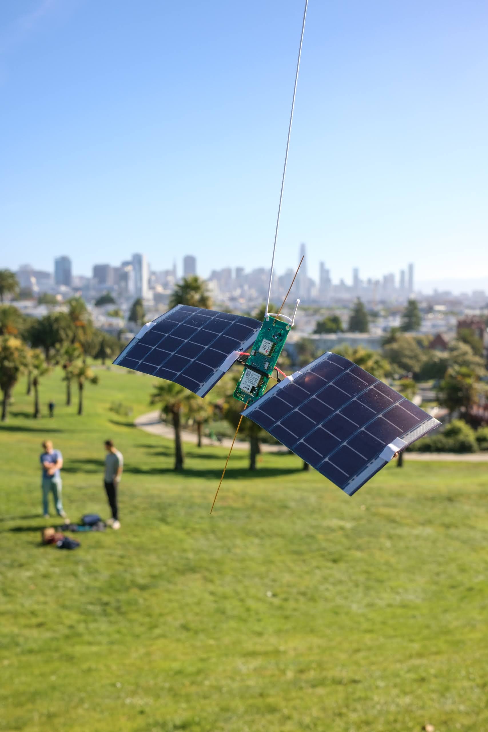 The complete Stratolink payload and solar panels suspended above Dolores Park.
